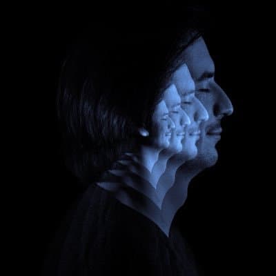 Vlad Tenev’s X profile photo, a blue multiple-exposure profile portrait.